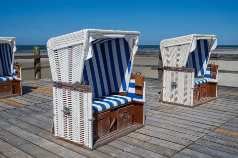 Beach chairs on wooden planks, Sankt Peter Ording, Eiderstedt, North Frisia, North Sea,