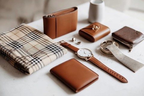 Beige and Brown Leather Accessories Flatlay. Modern business and lifestyle fashion accessories.