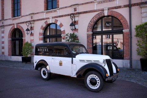 Black and white Renault Juvaquatre Editorial vintage car in front of headquarters, head office,