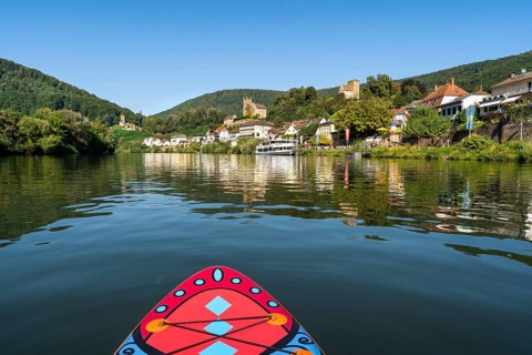 SUP board on the Neckar near Neckarsteinach. The ruins of Hinterburg Castle on the top left,