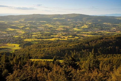 View of the Odenwald from the drum tower in Rimbach. Towns, forest, meadows, fields. Sunset.