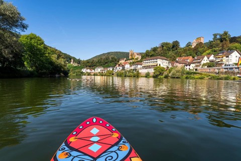 SUP board on the Neckar near Neckarsteinach. The ruins of Hinterburg Castle on the top left,