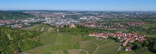 Panoramic view of a town with surrounding vineyards and a clear sky, view of Rotenberg near