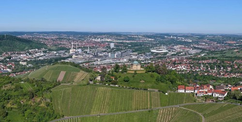 View of a cityscape with vineyards and hills under a blue sky, view of Rotenberg near Stuttgart