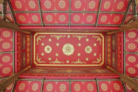 Ceiling with floral red and golden decorations in the Siamese Sala-Thai I temple, detail, pattern,