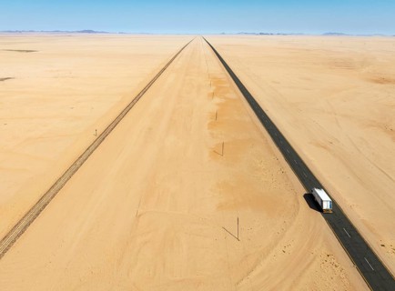 Rails and the B4 tarred road between Aus and Lüderitz in the southern Namib Desert. Aerial view.