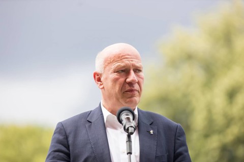 Kai Wegner (Governing Mayor of Berlin) gives a speech in front of the raising of the rainbow flag