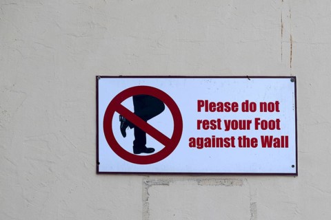 Prohibition sign Please do not lean your foot against the wall, Abu Dhabi, United Arab Emirates