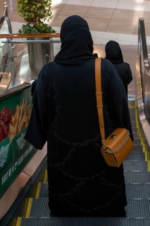 Veiled woman with handbag, Abu Dhabi, United Arab Emirates