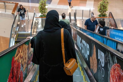 Veiled woman with handbag, Abu Dhabi, United Arab Emirates