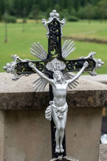 Metal cross with detailed Jesus figure in decorative design, Zgornje Jezersko, Gorenjska, Slovenia