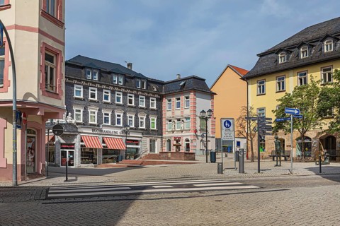 Market street with pharmacy fountain in Ilmenau, Thuringia, Germany