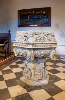 Baptismal font, sandstone baptismal font from the Renaissance period from 1603, created by H.