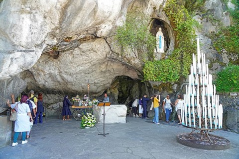 The Grotto of Massabielle in the Holy District in the Marian pilgrimage town of Lourdes, Pyrenees,