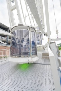 Close-up of a gondola of a Ferris wheel, shown in detailed surroundings, Ferris wheel construction,