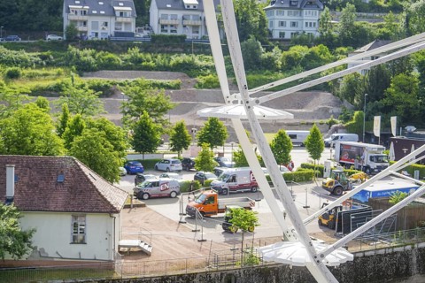 View of the town and parked vehicles from a Ferris wheel, Ferris wheel construction, Calw, Black