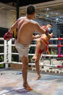 Thai boxing Muai Thai boxer in action, Pattaya, Thailand