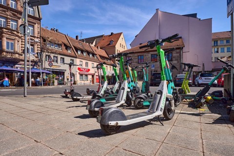 E-scooter in the city, problem, traffic problem, general architecture, pavement, pavement slabs,
