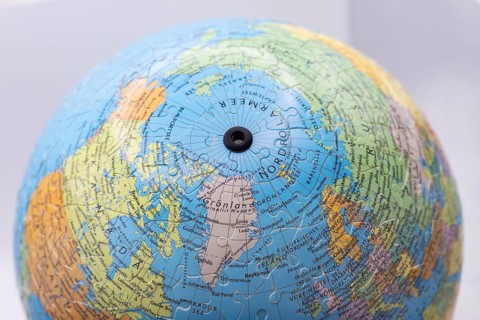Puzzle globe. Map made from puzzle pieces. Greenland and Denmark