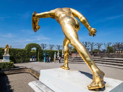 Golden sculpture, warrior with shield and sword, Herrenhausen Gardens, Baroque garden at castle