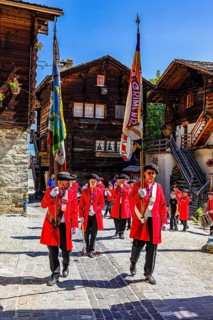 Pipers and drummers accompany the Corpus Christi procession, historic town centre, Grimentz, Val