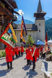 Pipers and drummers line up for the Corpus Christi procession, behind the church of Saint Theodul,
