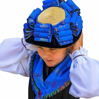 Young girl in traditional traditional costume and with traditional hat, Grimentz, Val d'Anniviers,