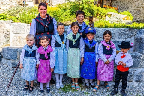 Women and children in traditional costumes, historic village centre, Grimentz, Val d'Anniviers,