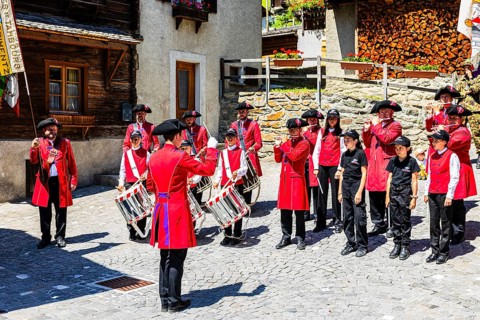 Pipers and drummers play in the historic village centre, Grimentz, Val d'Anniviers, Valais Alps,