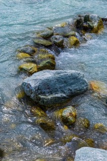 Boulders obstruct the flow in the mountain stream La Navisence, near Zinal, Val d'Anniviers, Valais