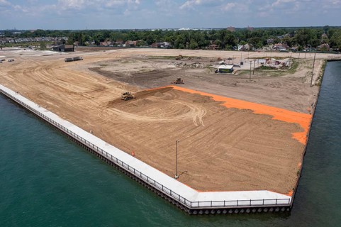Detroit, Michigan - Workers spread clean dirt after old industrial contamination of cadmium,