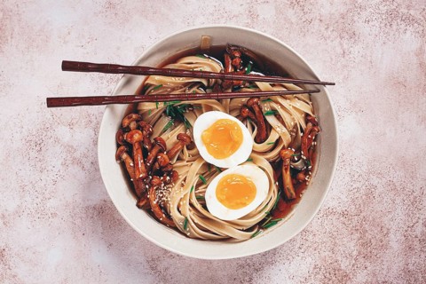Buckwheat noodles soba with shimeji mushrooms, with boiled egg, green onion, sesame seeds,