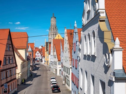 View from the medieval town wall over the houses of the historic old town to the tower of St