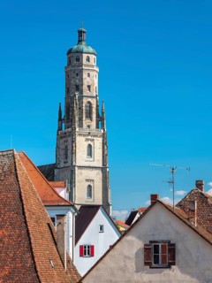 View from the medieval town wall over the houses of the historic old town to the tower of St