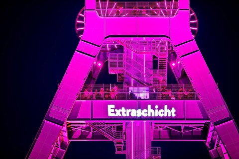 Illuminated headframe of the German Mining Museum with people, Extraschicht, Bochum, Ruhr area,