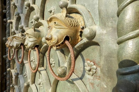 Lion heads on the main portal of the Roman Catholic Basilica of St Mark on St Mark's Square,