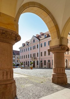 View of Hotel Börse through the arches of the New Town Hall of Görlitz, Lower Market Square -