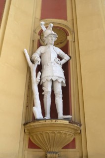 Sculpture of the giant Thyrsus, legendary figure, at the entrance portal of Wilten Abbey,