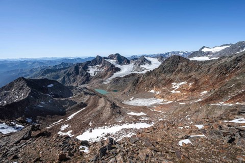 View of mountain basin with blue glacier lakes, behind summit Becher with Becherhaus, glacier