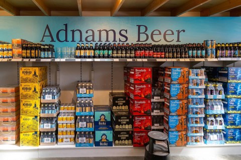 Adnams beer products on display inside brewery shop, Southwold, Suffolk, England, UK