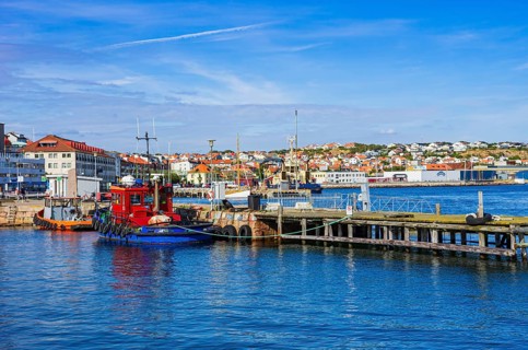 Picturesque scenery of small tugboats in the harbour of Lysekil, Bohuslän, Västra Götalands län,