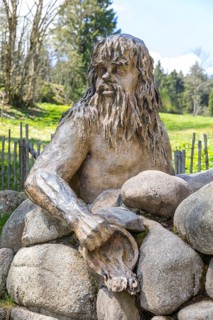 Figure of the river god Danuvius by sculptor Wolfgang Eckert at the source of the Breg, source of