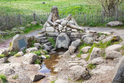 Figure of the river god Danuvius by sculptor Wolfgang Eckert at the source of the Breg, source of