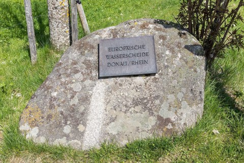 Signpost European watershed Danube and Rhine near the source of the Danube in Furtwangen in the