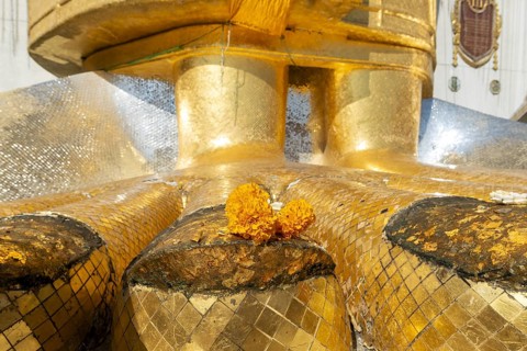 Feet of a 32 metre high standing Buddha decorated with glass mosaics and 24-carat gold, Luang Pho