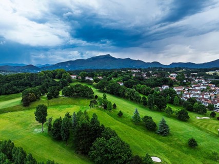 Sunset and storm clouds over Pyrenees and Saint-Jean-de-Luz from a drone, Nouvelle-Aquitaine,