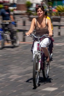 Woman riding a bicycle, Photo with motion blur, City of Quito, Pichincha province, Ecuador, South