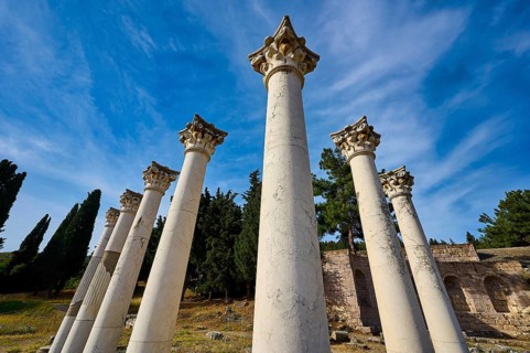 Ancient columns stretch under a clear blue sky, Temple of Apollo, Corinthian Columns, Asklipion,