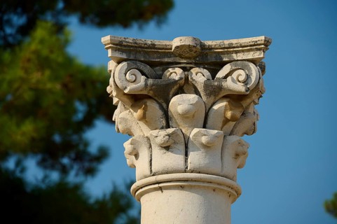 Close-up of an ornate capital in front of a clear sky, Temple of Apollo, Corinthian columns,