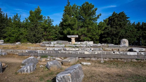 Stone ruins in the open air surrounded by trees, Doric temple, early Christian altar, Asklipion,